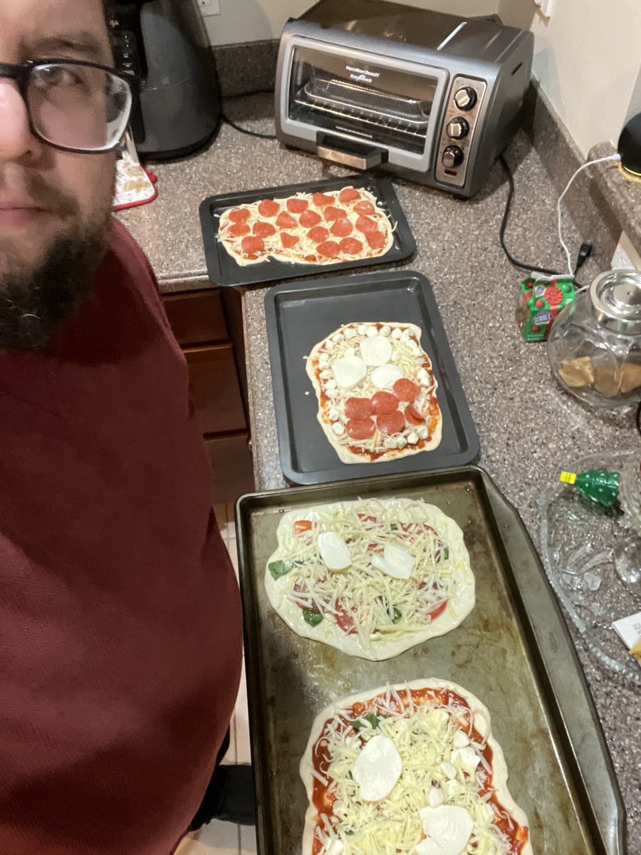 Mark Gabrielli making homemade pizzas